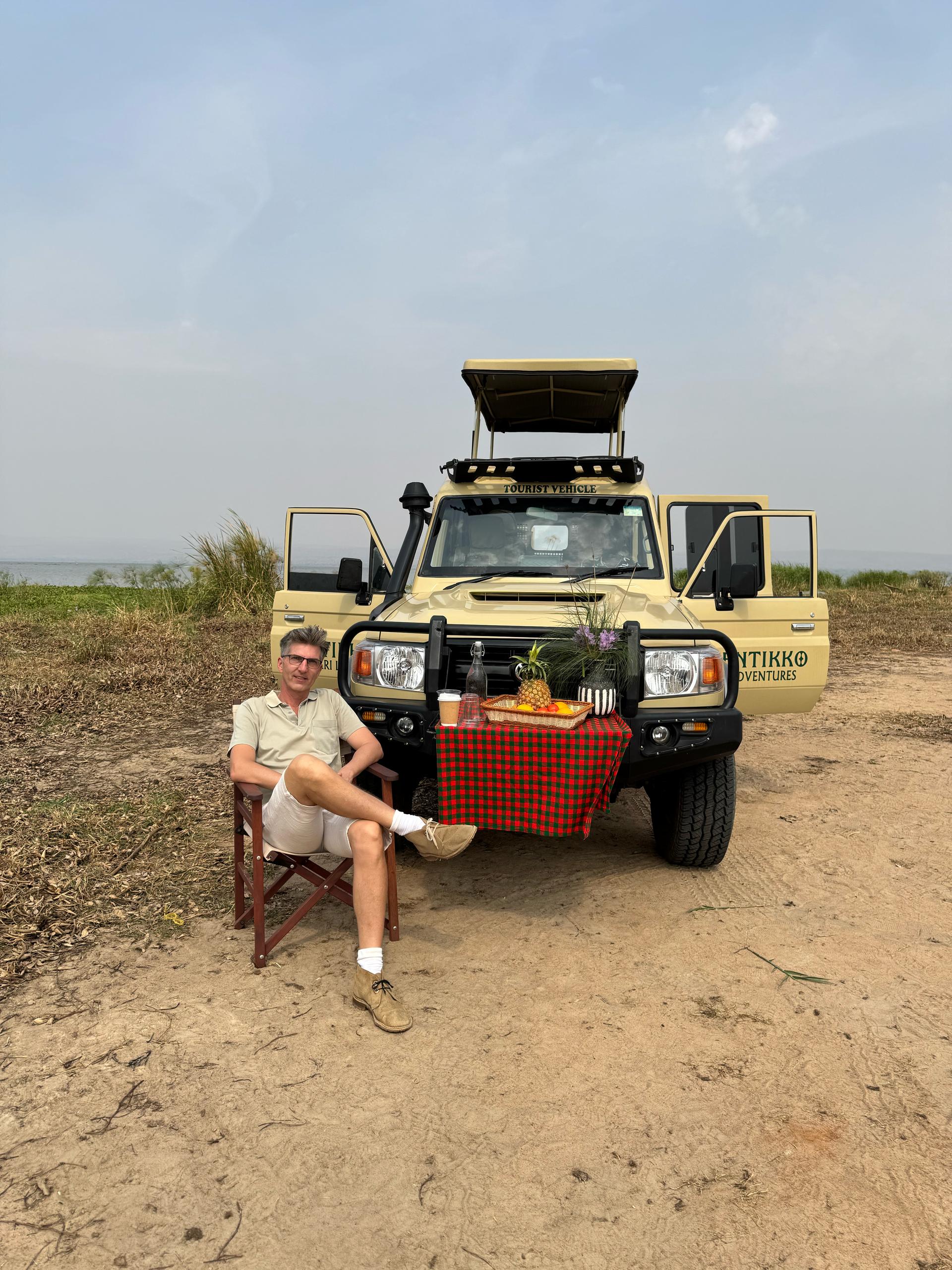 This image highlights the immersive experience of a guided game drive with Entikko Safari Lodge where guests get to relax and witness Uganda’s wildlife up close from open-roof vehicles.