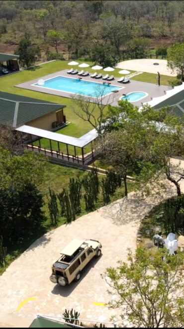 Landscape view of Entikko Safari Lodge entrance with scenic natural surroundings in Uganda